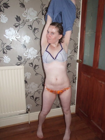 cute blonde posing in jeans and shirt         