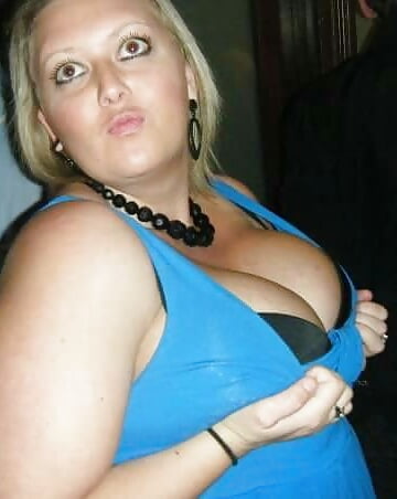 Huge boob blonde BBW flaunts deep cleavage adult photos