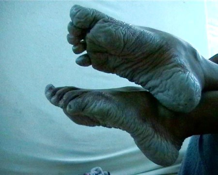 Bianca's wet wrinkled feet
