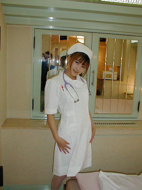 Japanese amateur dressed in nurse's in the hotel room adult photos