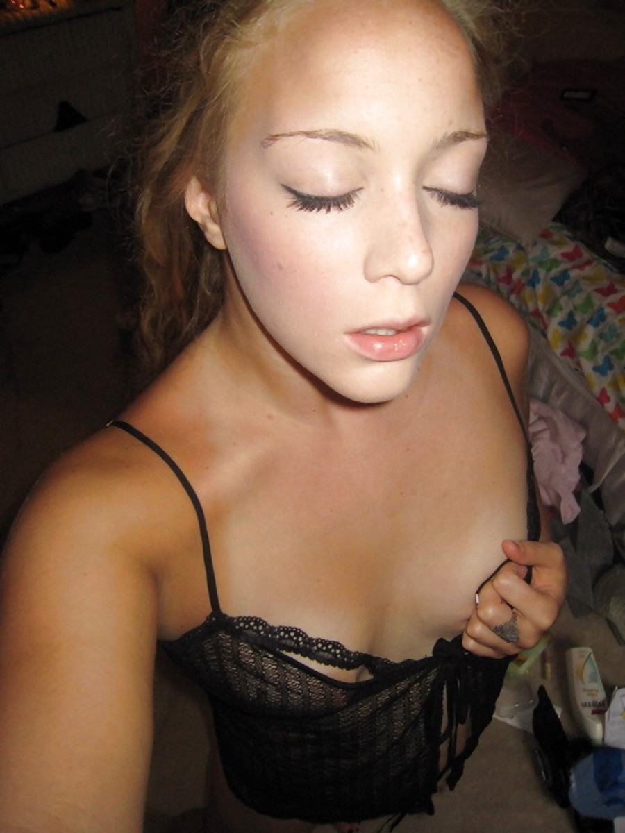 Blonde teen flashing her small tits adult photos