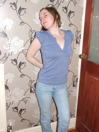 cute blonde posing in jeans and shirt         