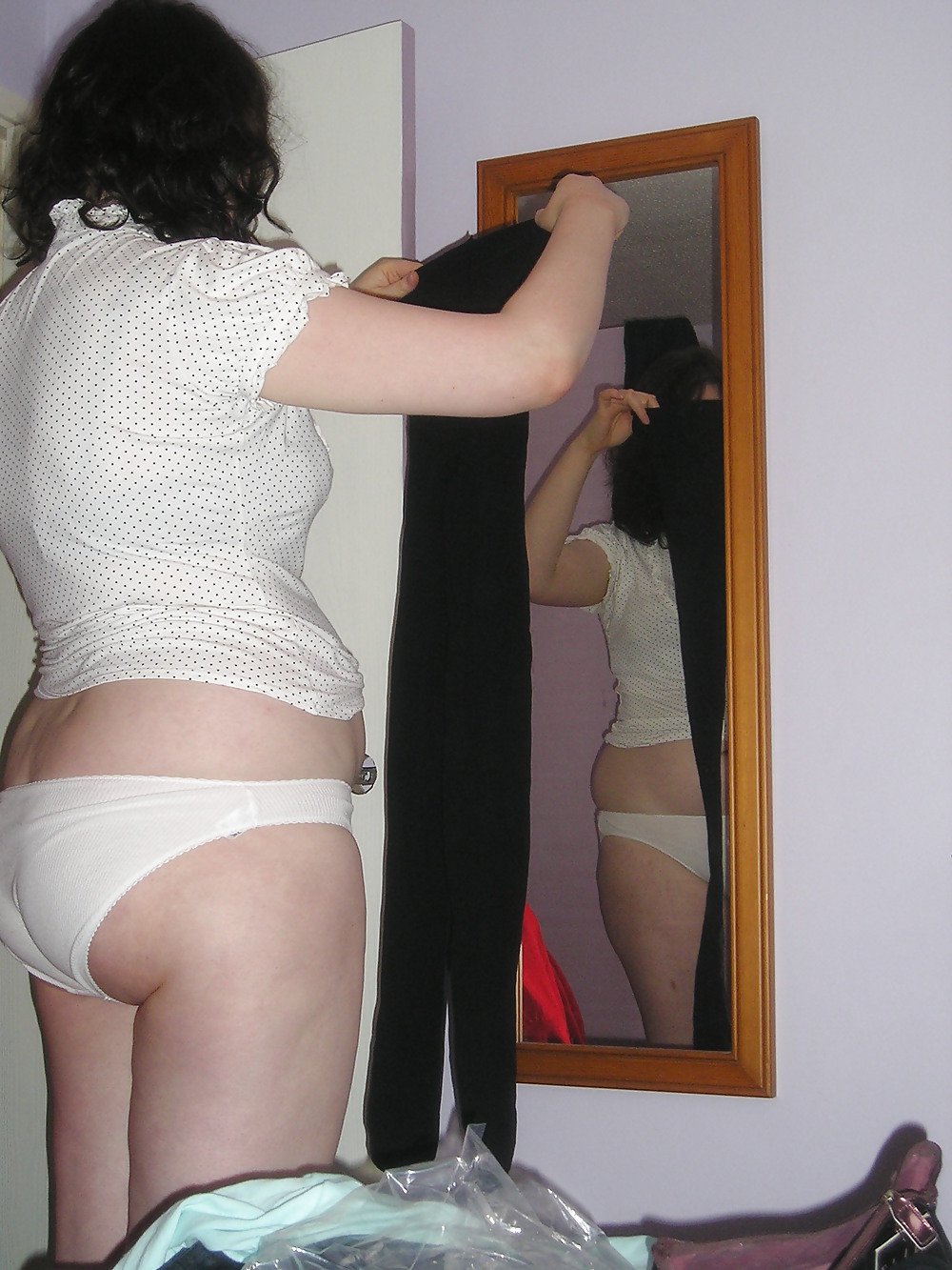 Shaven Slut getting dressed adult photos