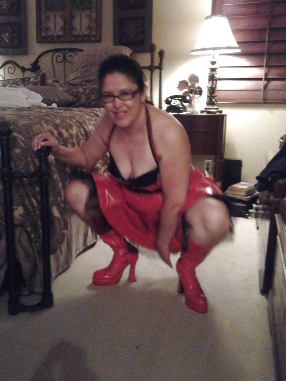 MILF in red vinyl PVC fetish dress and boots adult photos