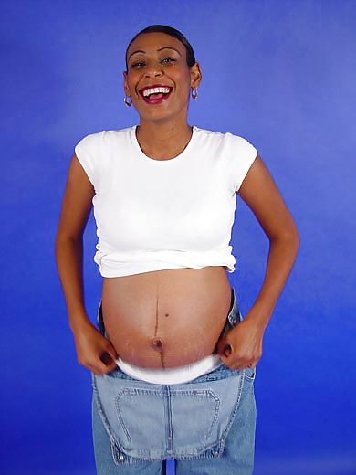 Pregnant black woman showing off adult photos