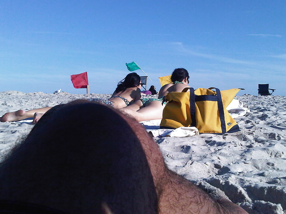 asians laying on the beach adult photos