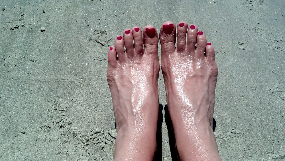 Feet at the beach. adult photos