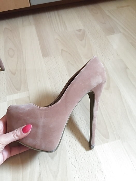 High Heels In Her Hand adult photos