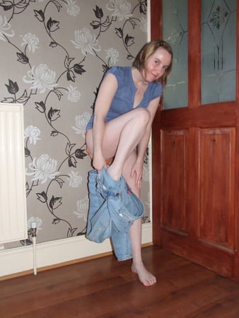 cute blonde posing in jeans and shirt         