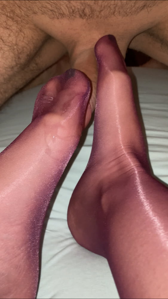 Her sexy legs and feet in purple nylon pantyhose and mules - 76 Photos 