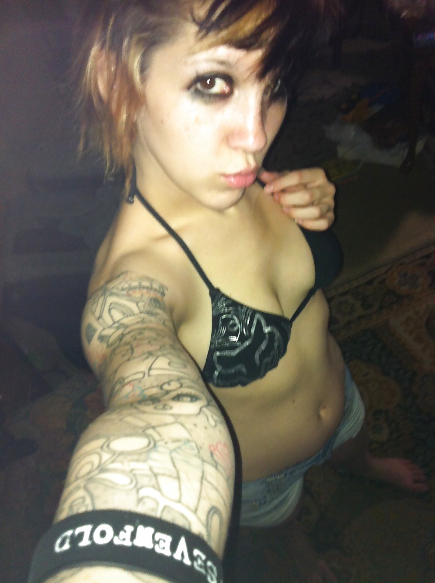 Emo tattoed girl with  short hair adult photos