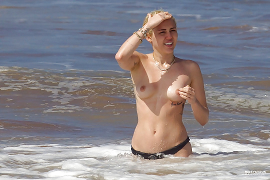 Miley Cyrus swimming topless in Hawaii adult photos