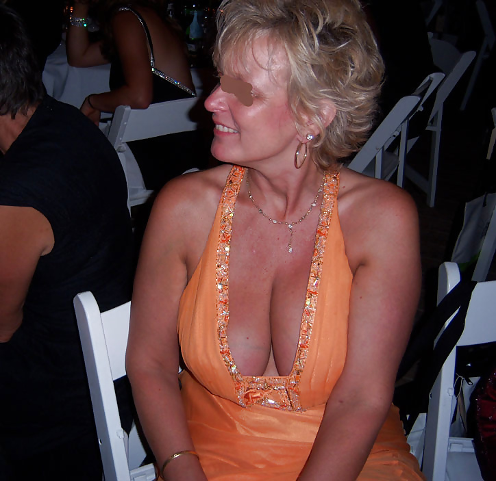 Busty Blonde MILF adult photos