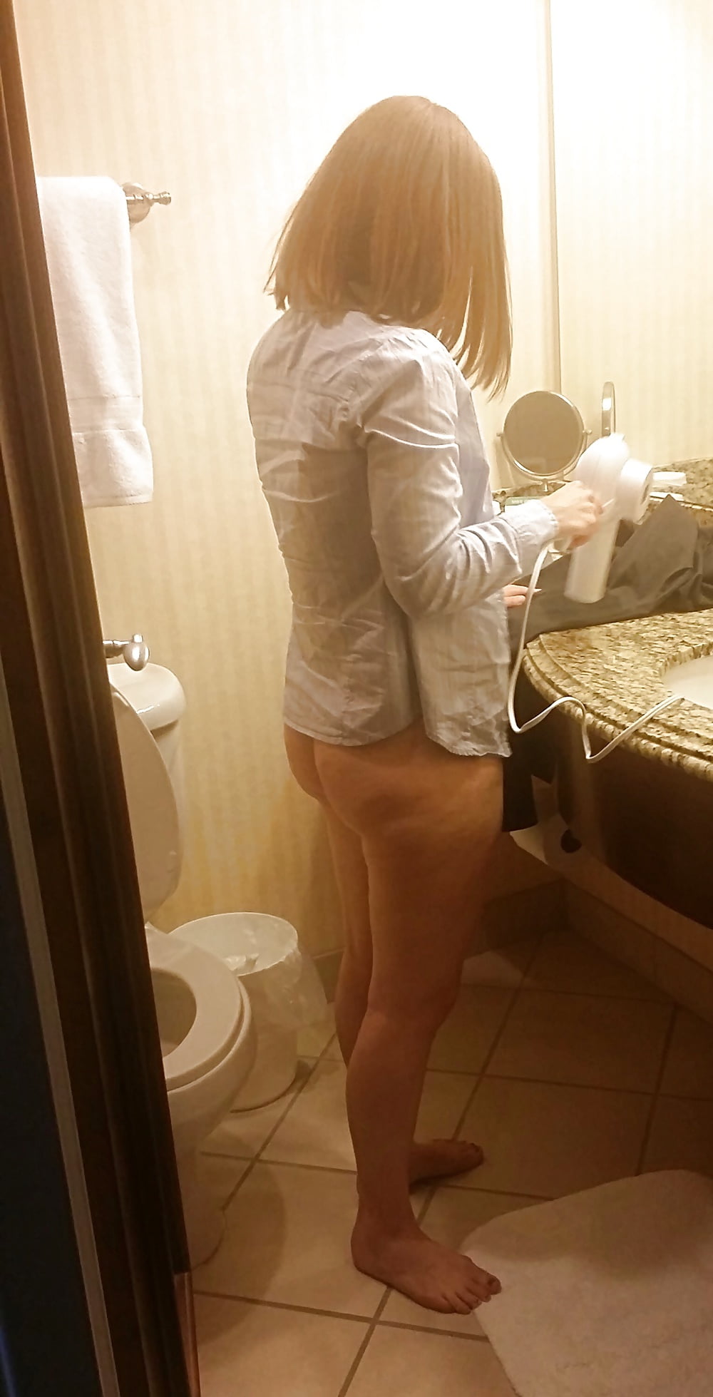 Shy MILF wife in the bathroom adult photos