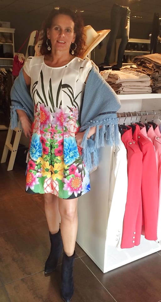 Dutch slut shows clothes from her own shop adult photos