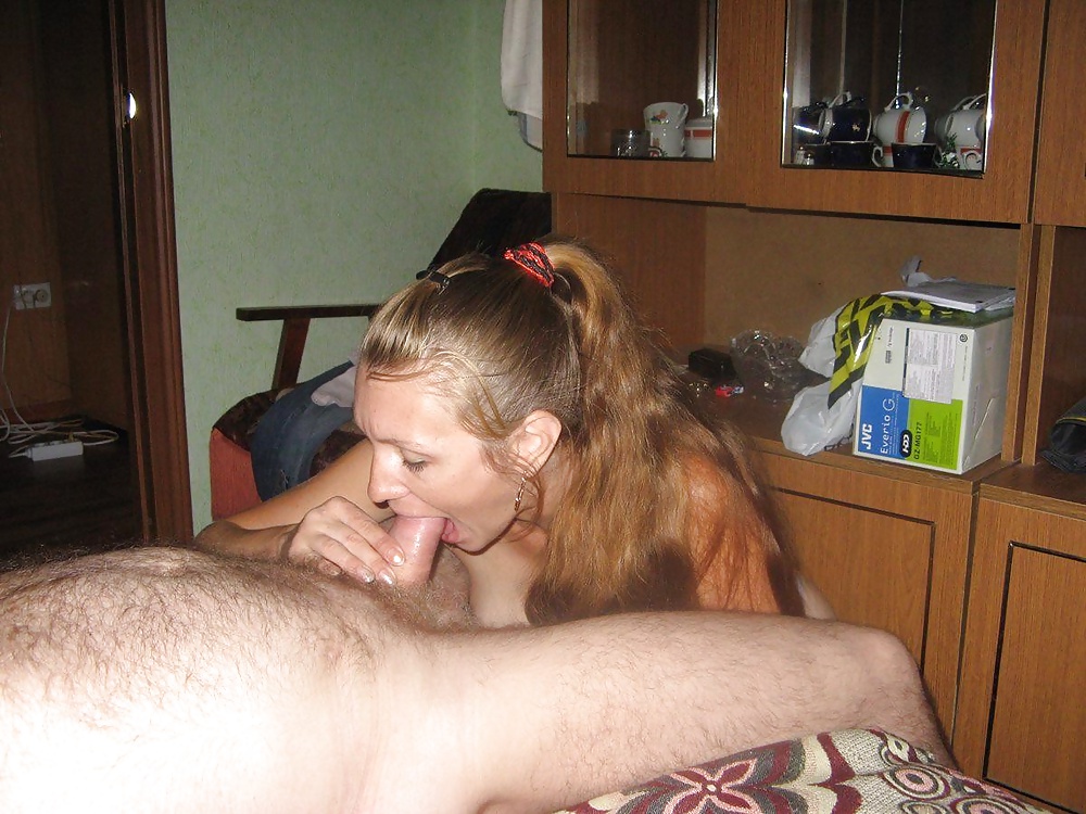 Silly Russian redhead posing and sucking cock adult photos