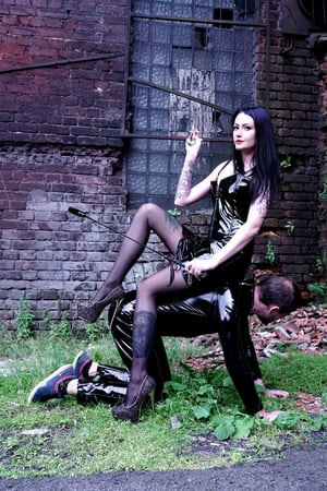 dominatrix nika on a walk with her slave         