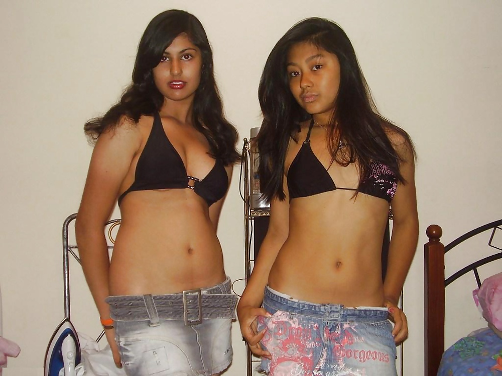 Two Sexy Teens Posing for the Camera adult photos