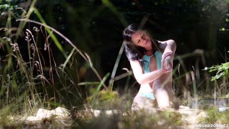 sexy brunet girl sunbathing         