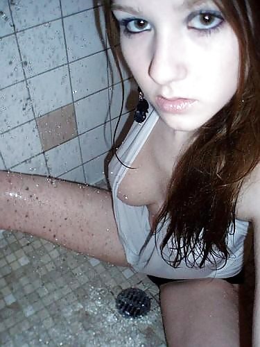 Sweet wetlook girl under the shower with her clothes on adult photos