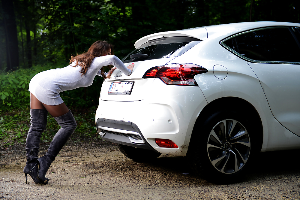 Bootfetish: girl in thigh high boots pushing a car adult photos