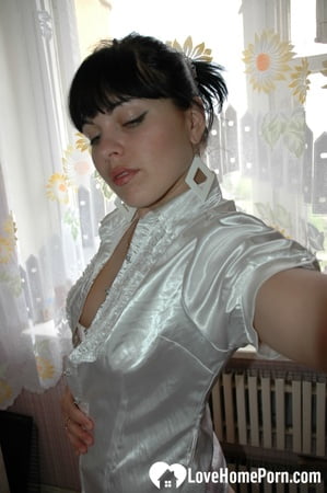 Smoking mom in stockings showing off her legs