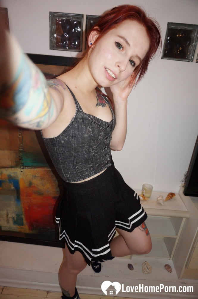Desirable redhead painter showing off sexy outfits - 20 Pics 