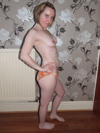 cute blonde posing in jeans and shirt         