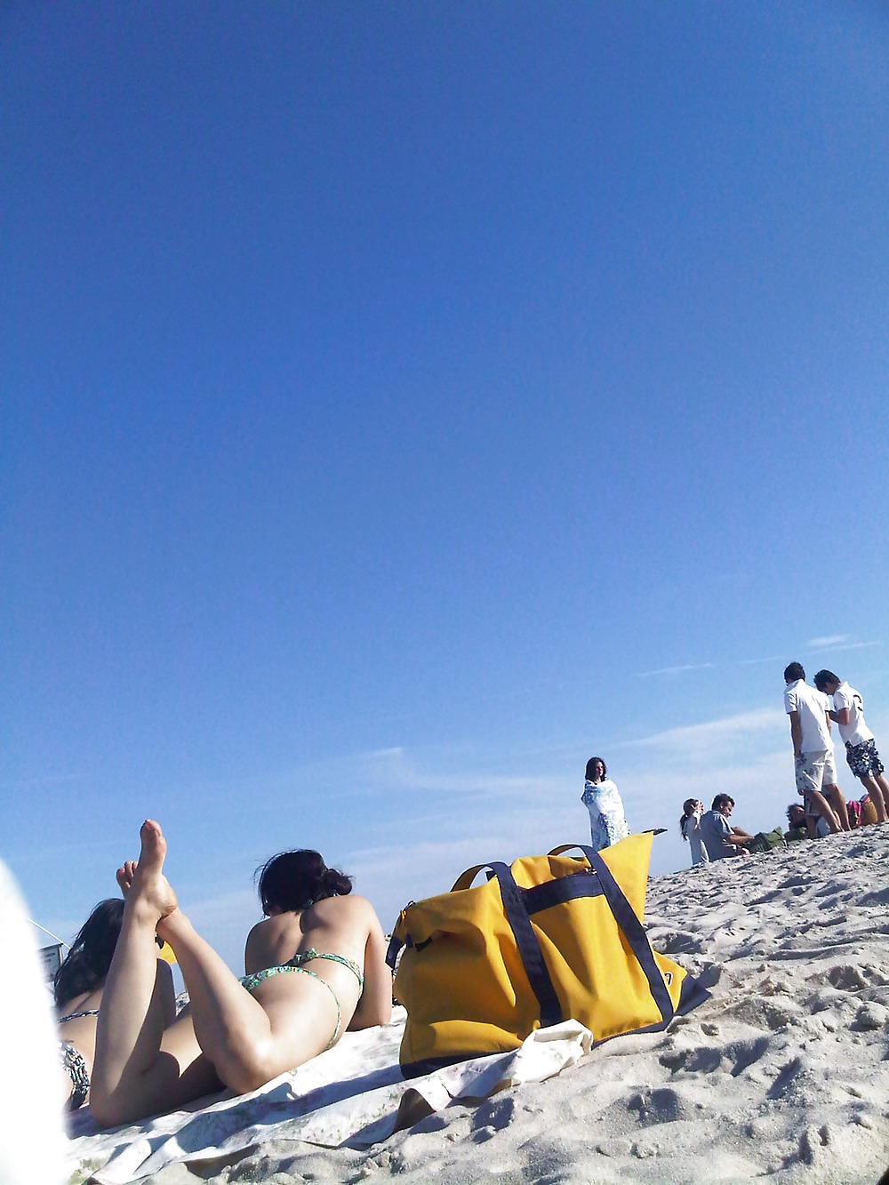 asians laying on the beach adult photos