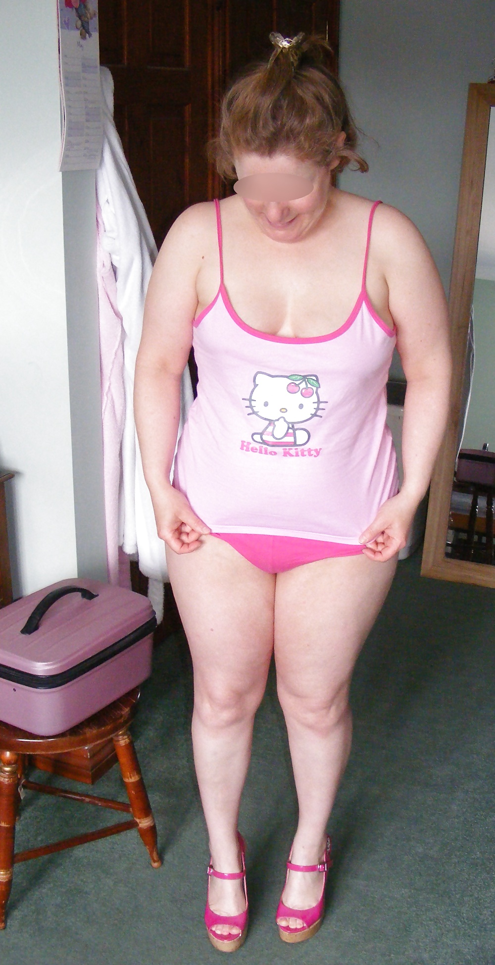 Slut in pink heels, in and out of Hello Kitty pyjamas adult photos